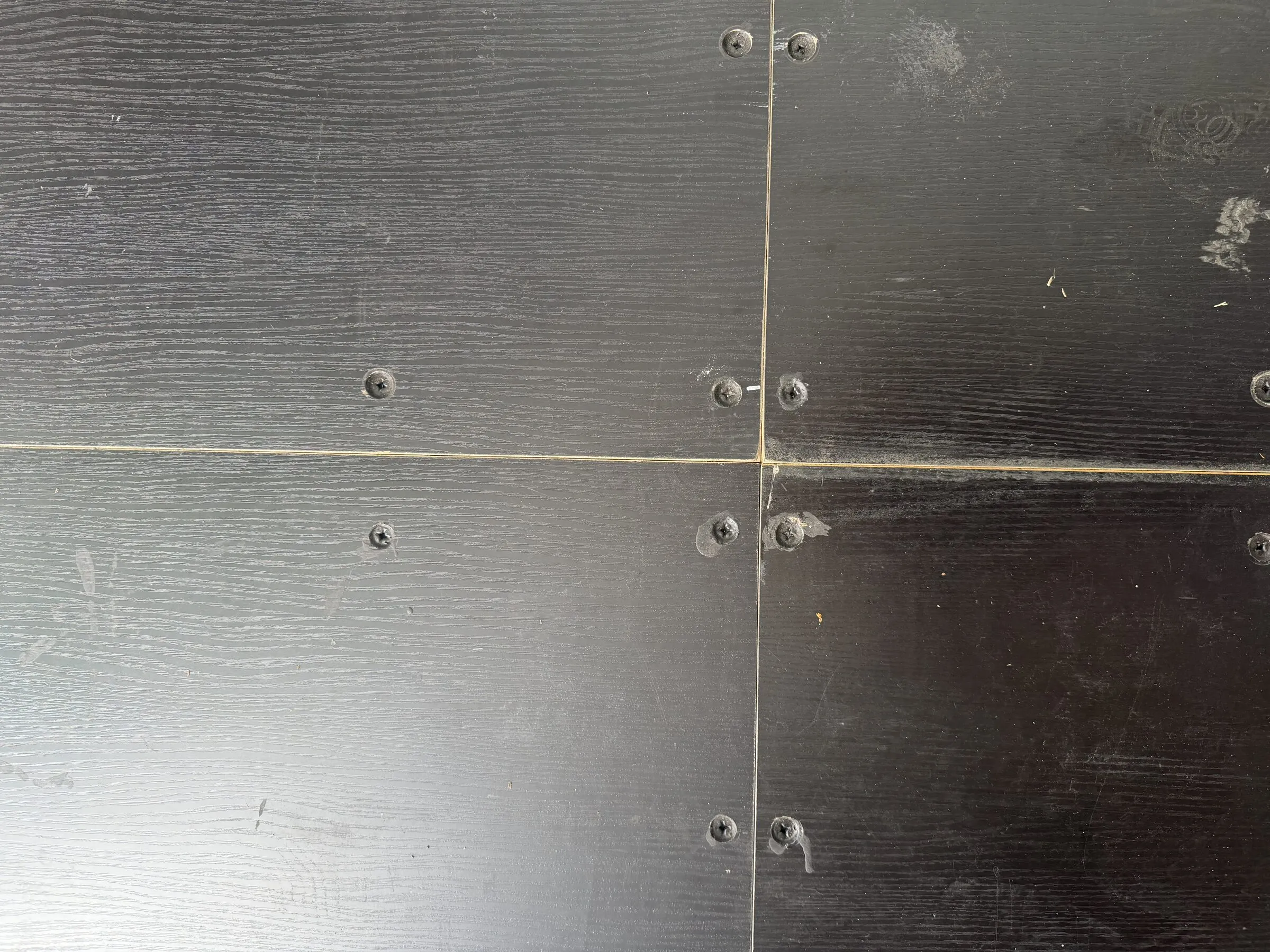Black floor panels inside a resort container