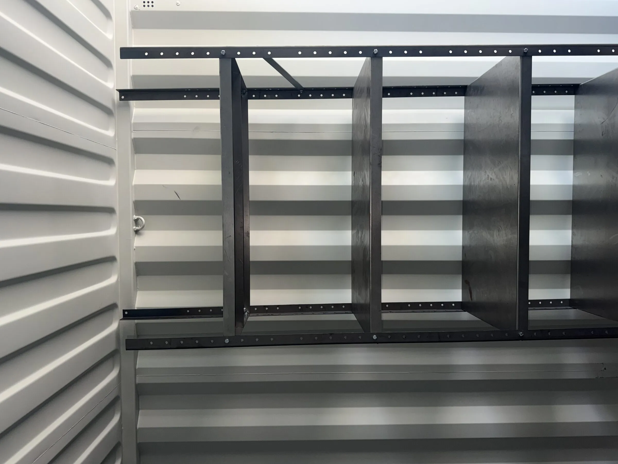 Metal shelving rack inside a resort container