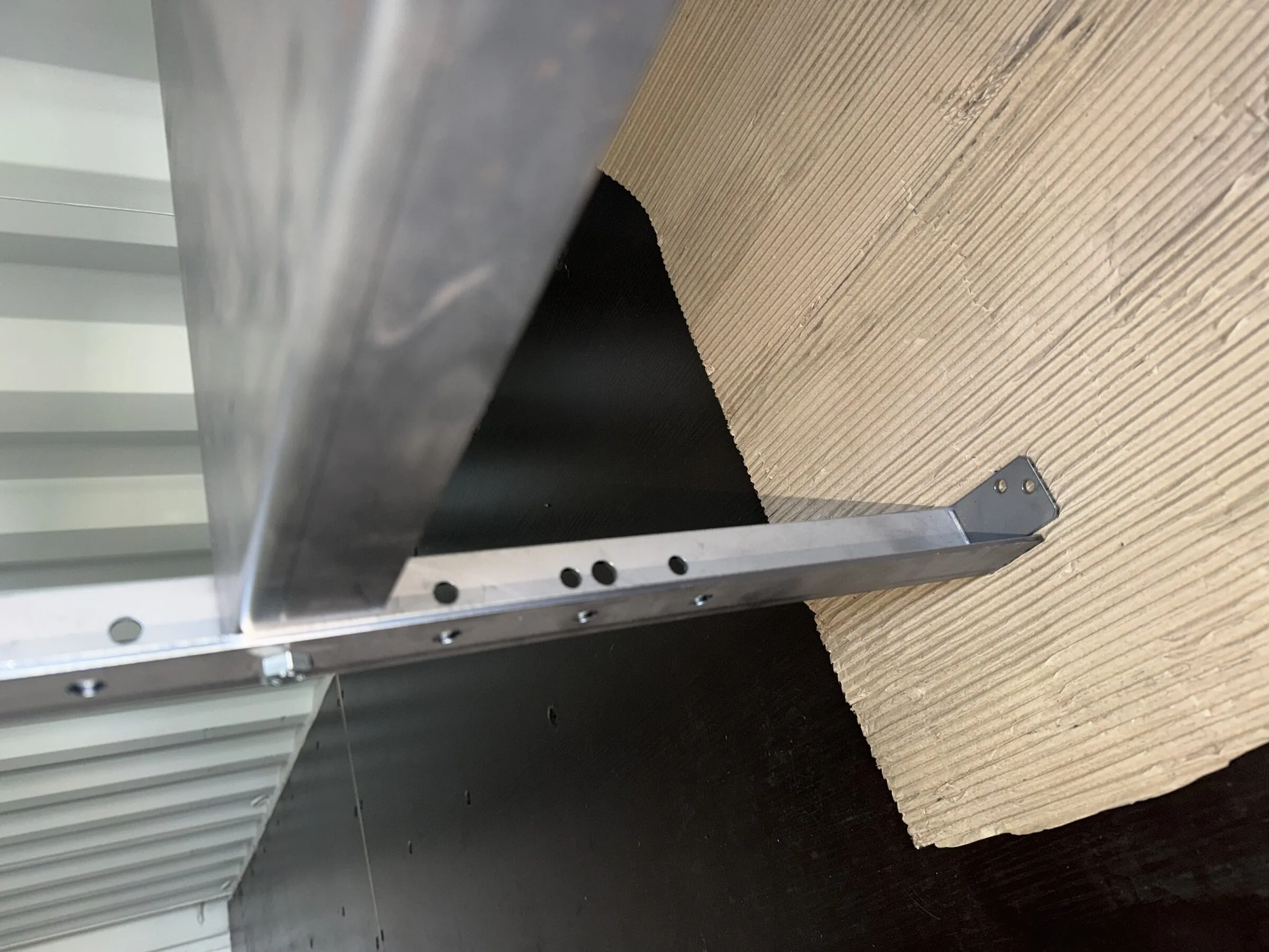 Close-up of a stainless steel shelf edge