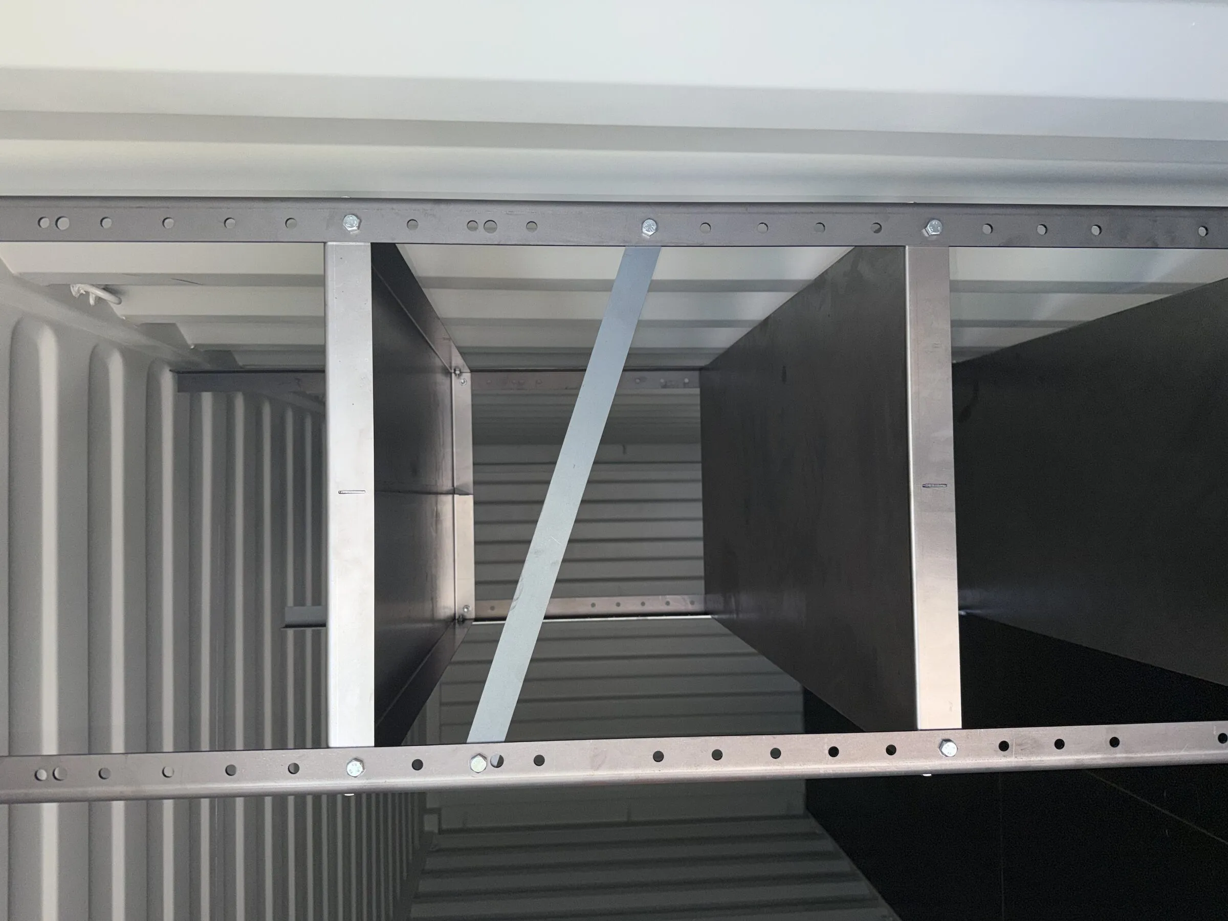 Stainless steel shelving inside a resort container