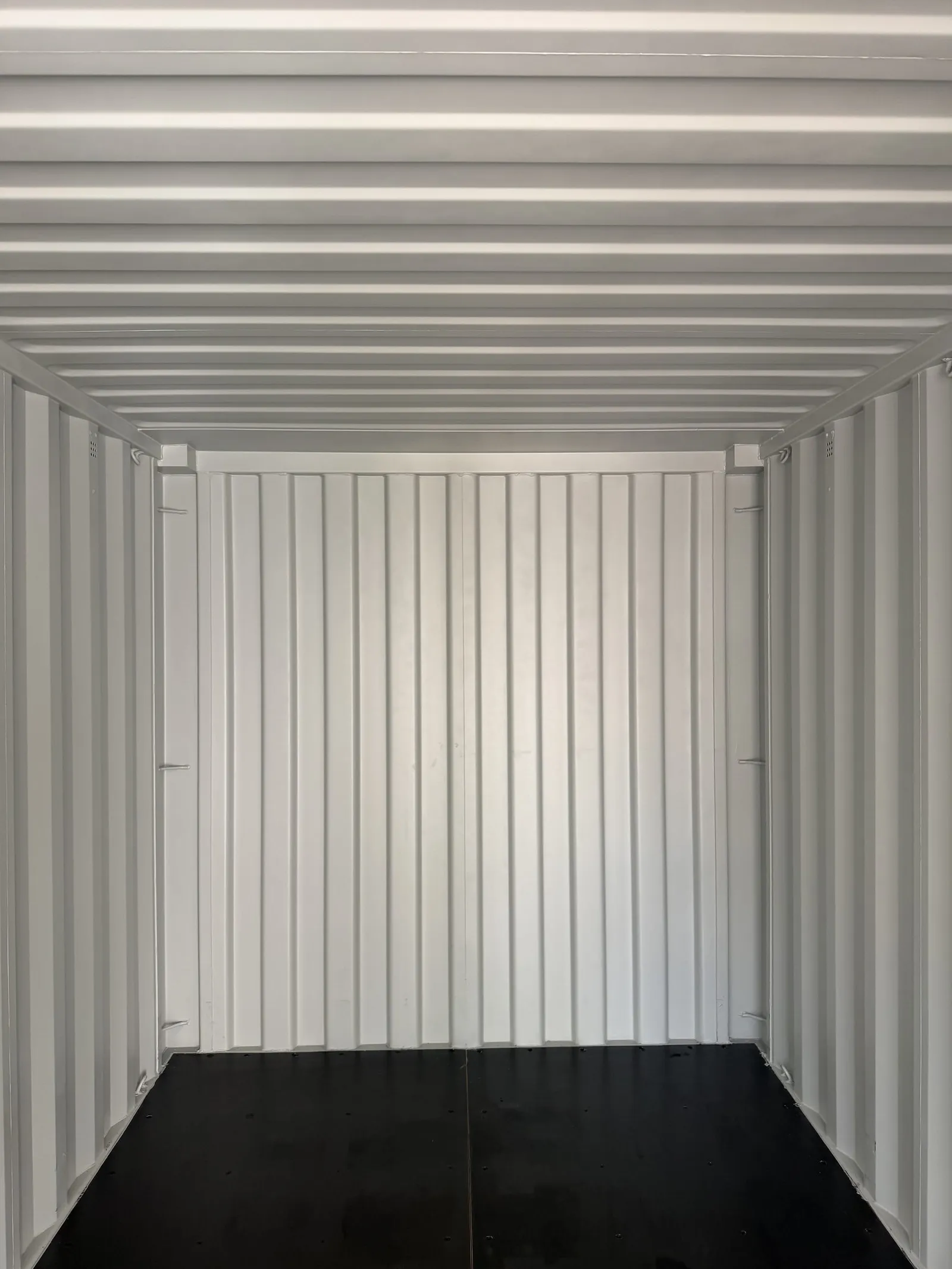 Empty storage interior of a white resort container