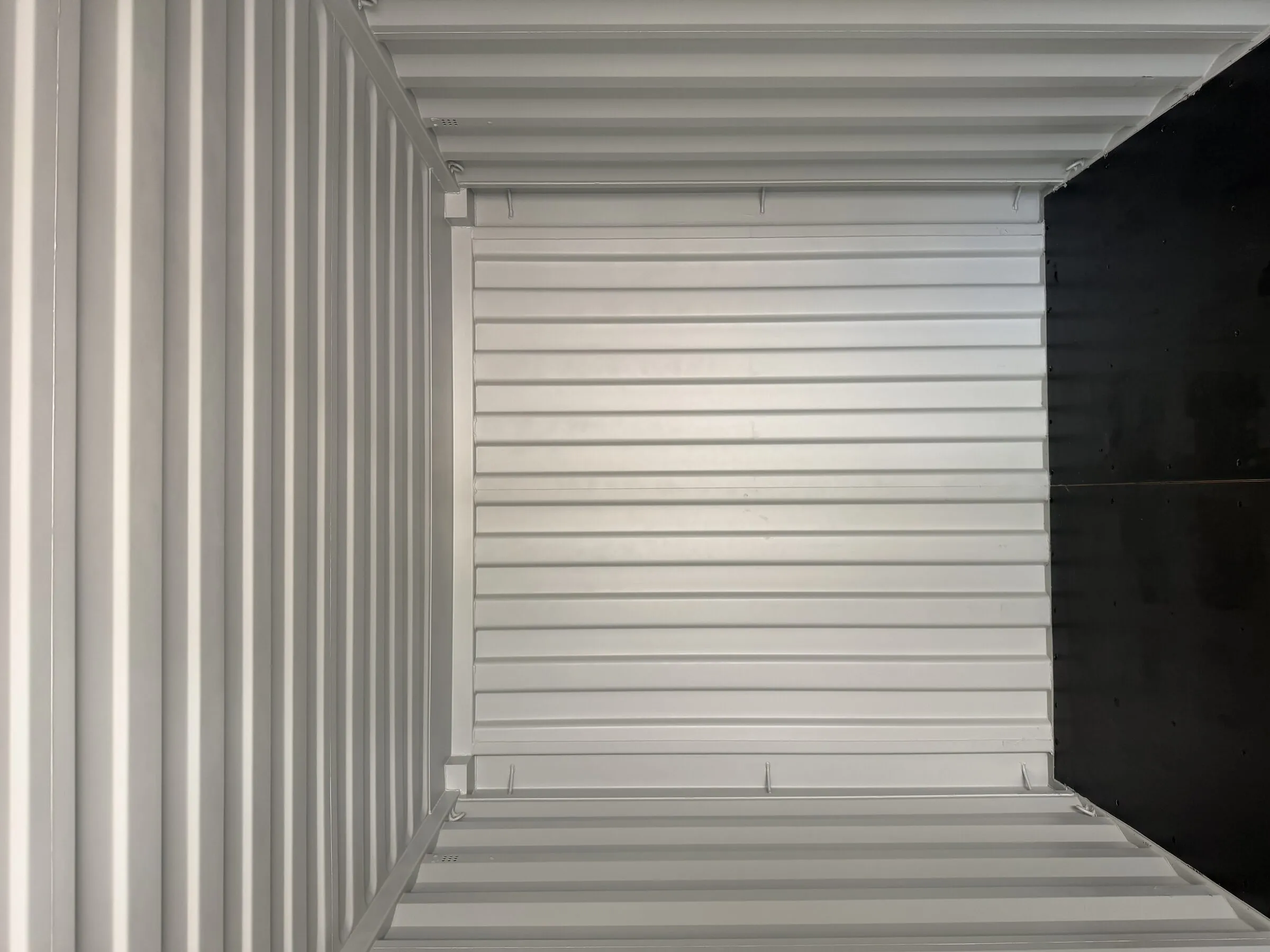 Empty storage interior of a white resort container