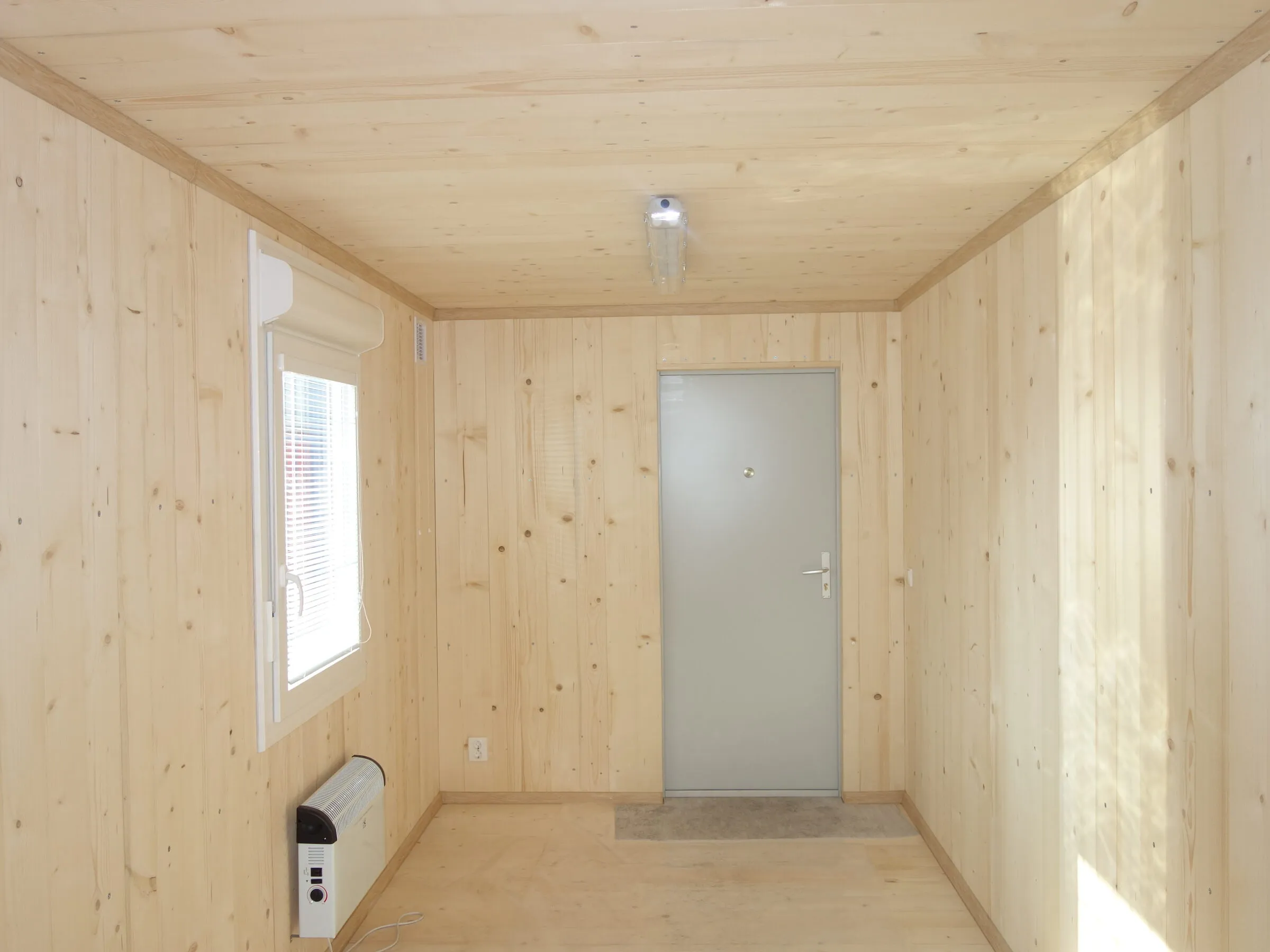 Wood-lined module interior of the type supplied, with a window