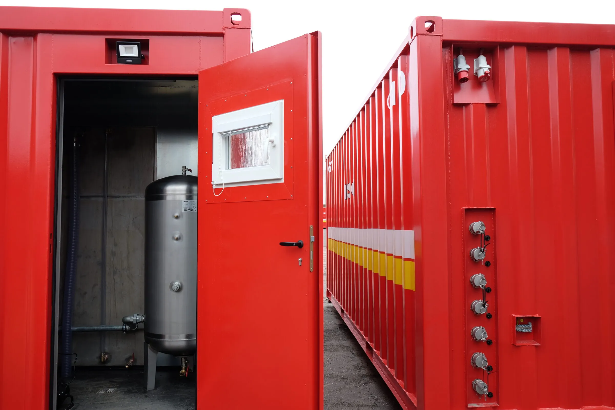 Red technical container with a water tank, exterior