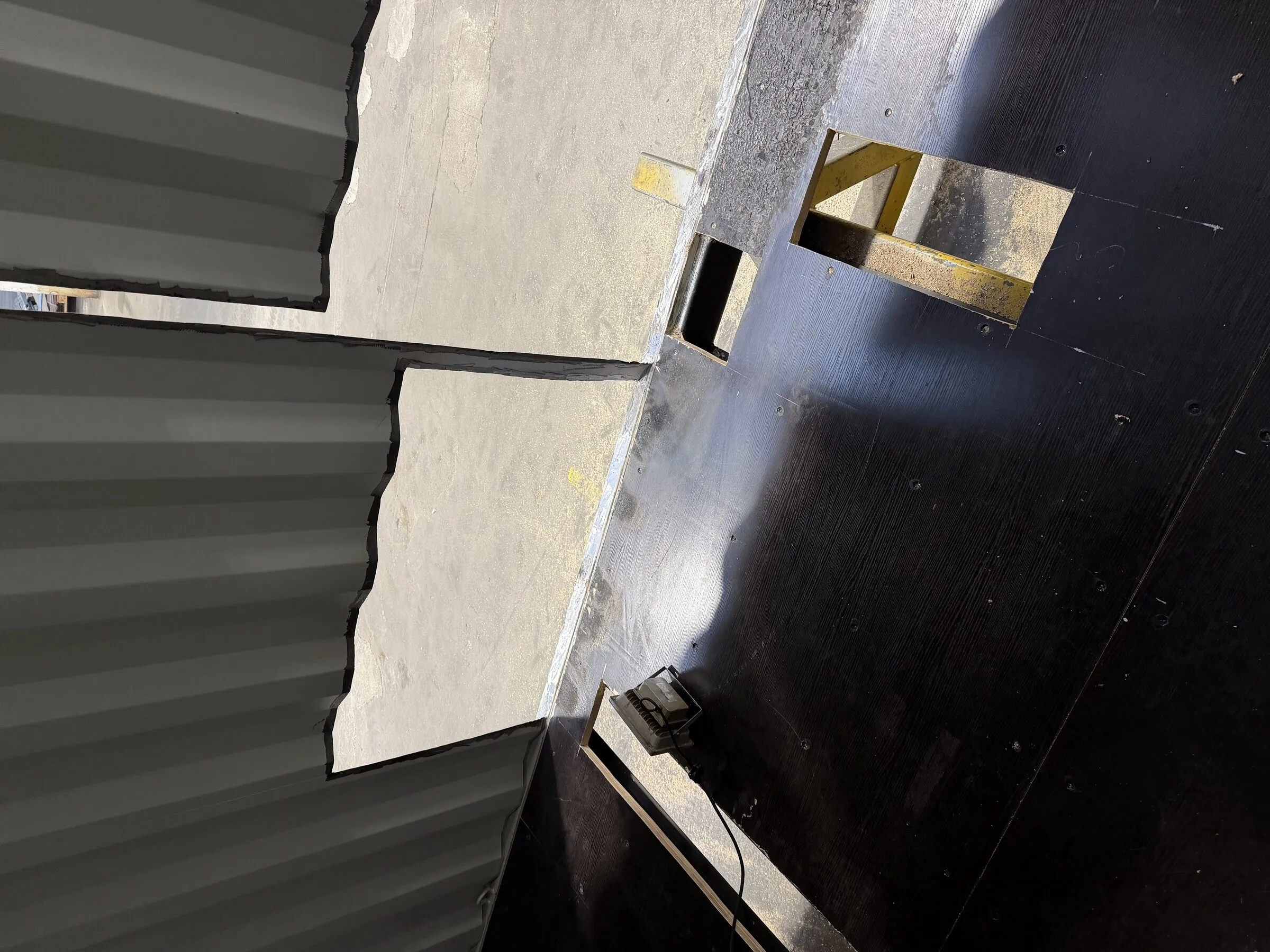 Floor view inside a black fire-training container
