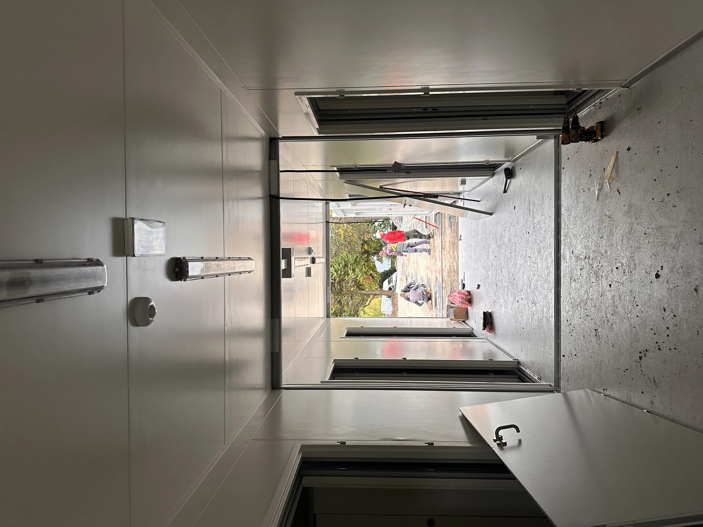 Corridor module looking towards an open door during construction
