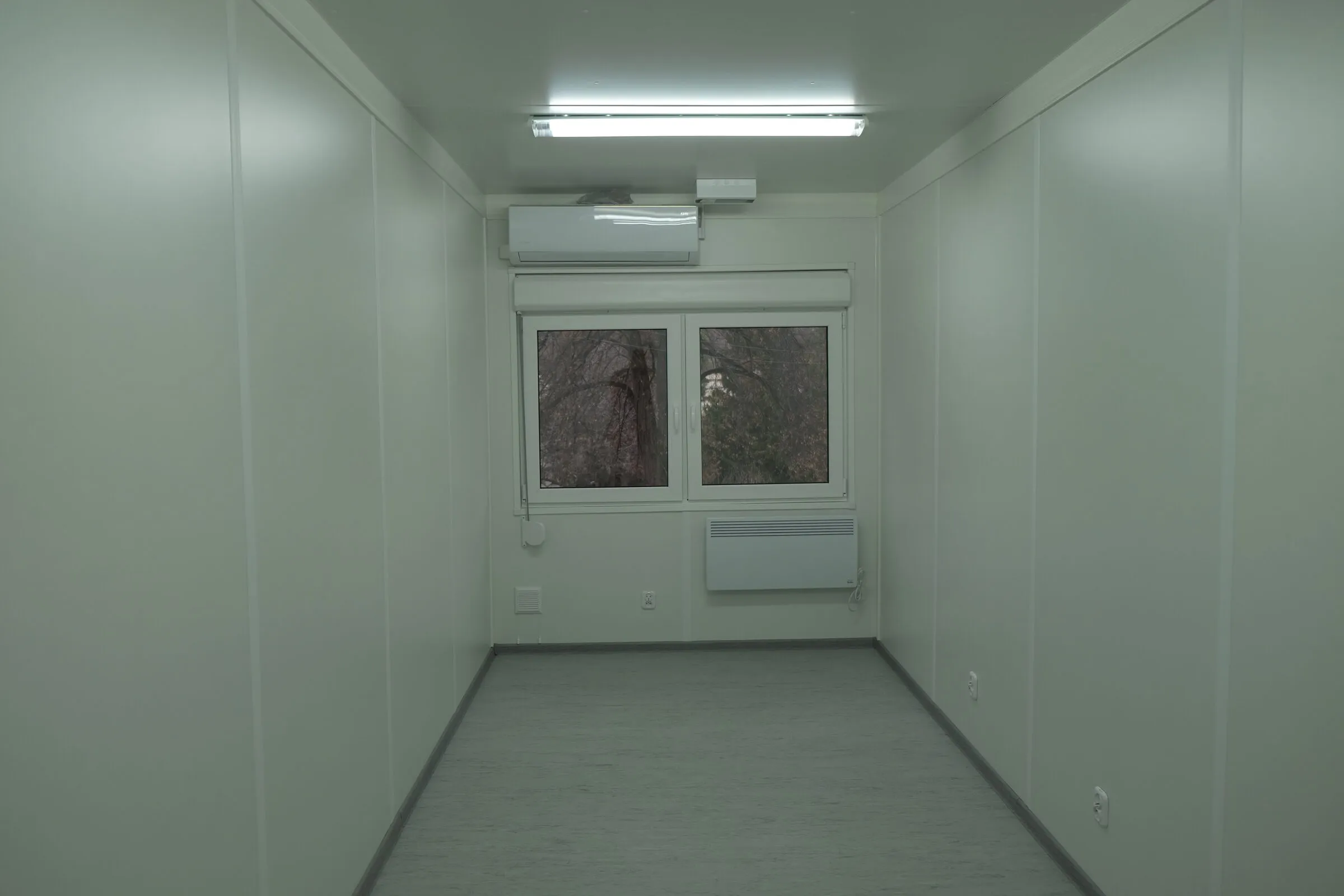 Module interior room with a window, angled view