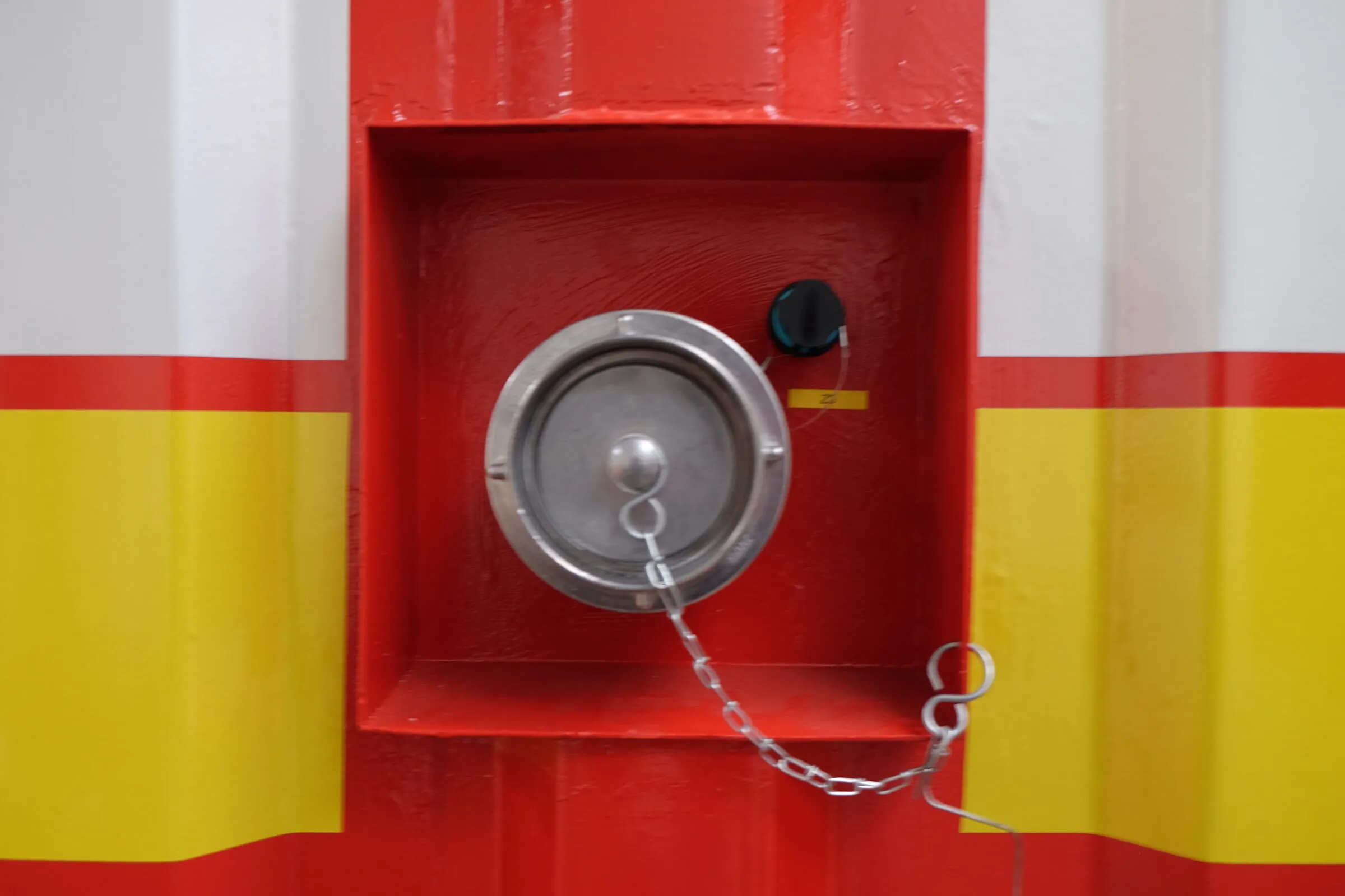 Valve and coupling detail on a red technical module