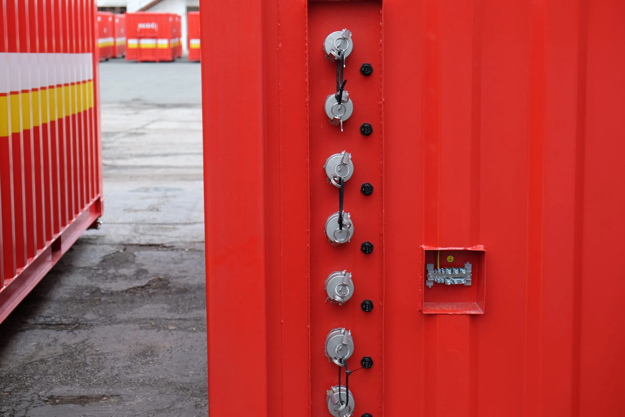Row of valve couplings on a red technical module