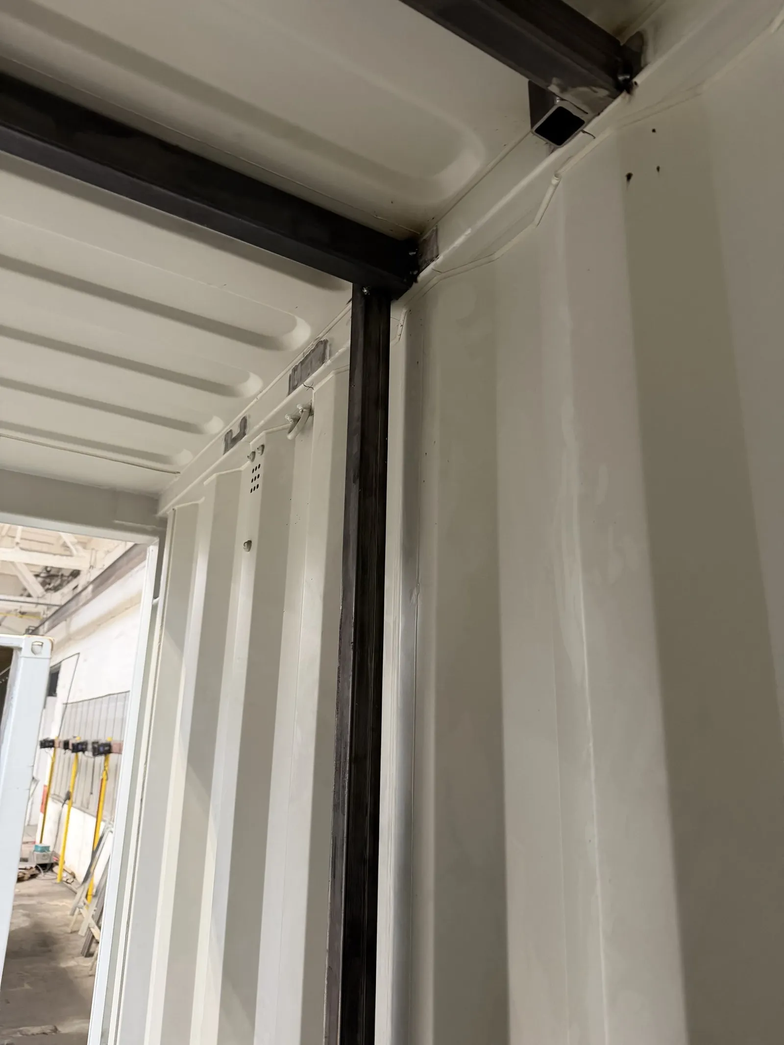 Steel frame corner under fabrication inside a module