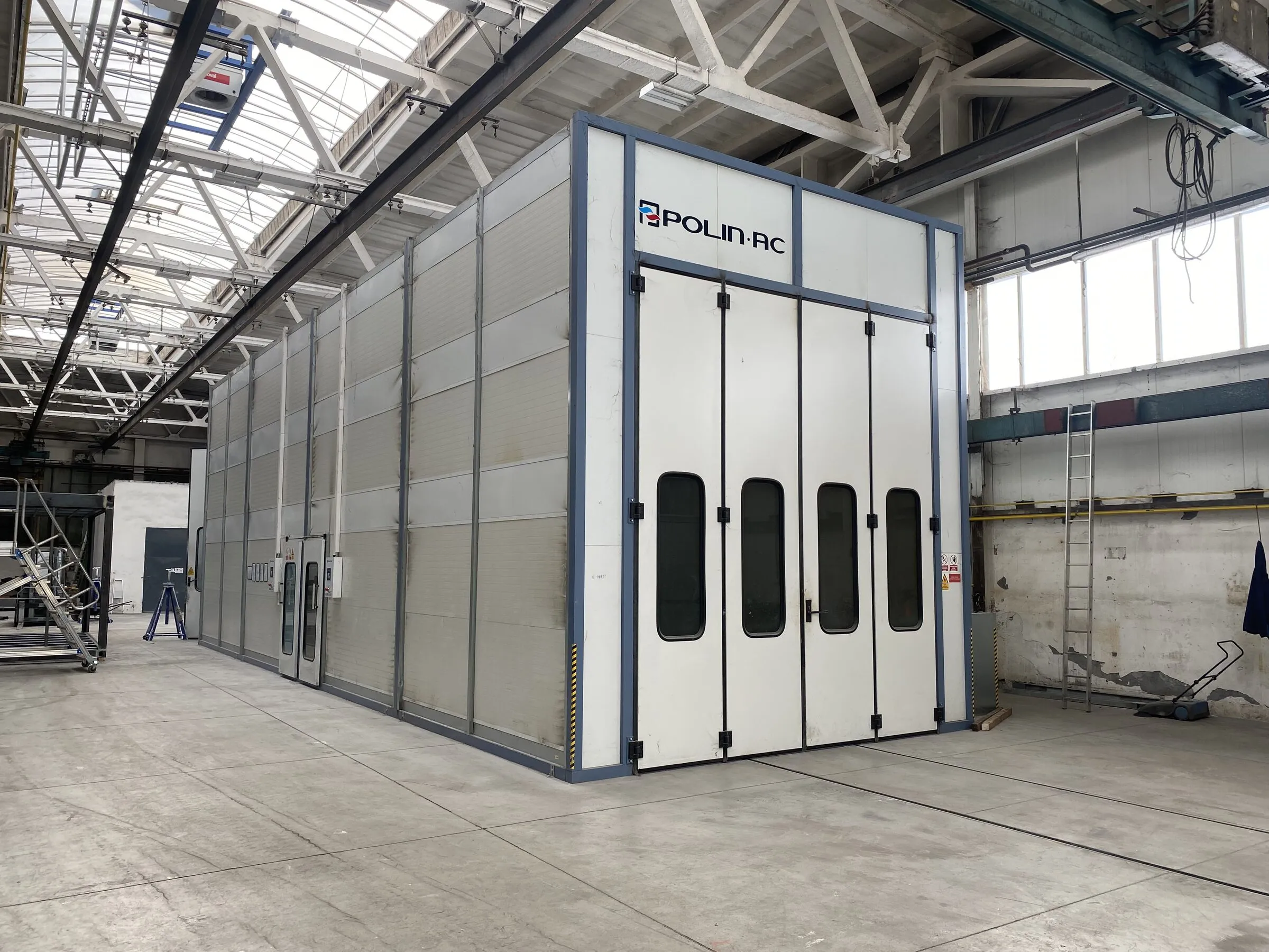 Paint booth with a weldment inside